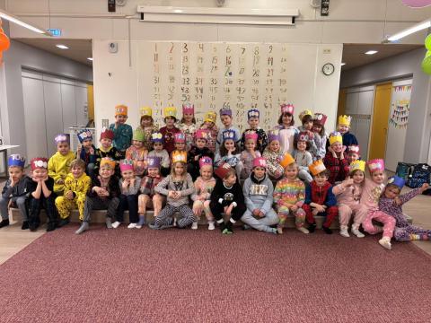 First-grade students wearing their 100-day crowns